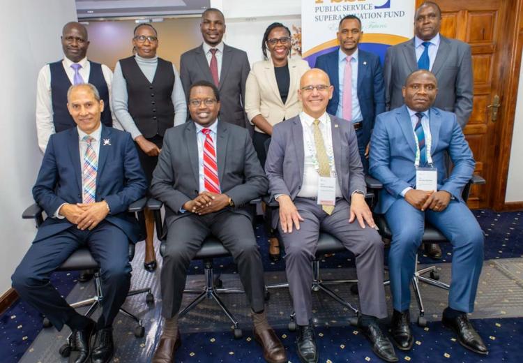 ISSA Officials and PSSF management team pose for a photo during the visit